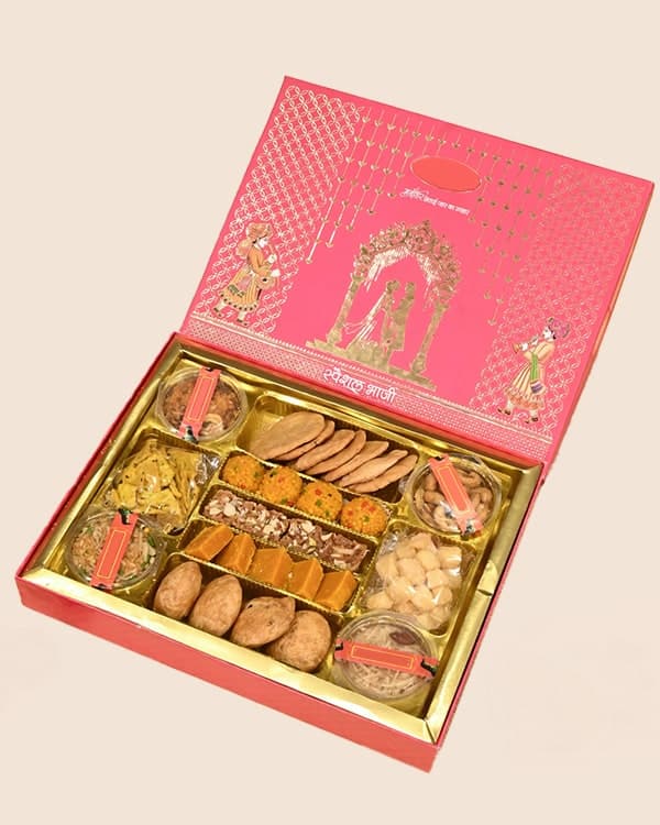 Pink 1.5 kg bhaji box with assorted sweets and namkeen