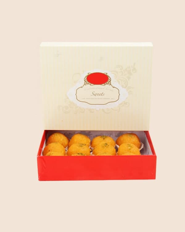 500 gm red and cream sweet box with laddus